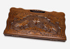 Carved beechwood backgammon board with two lions and an octagon ornament, propped open