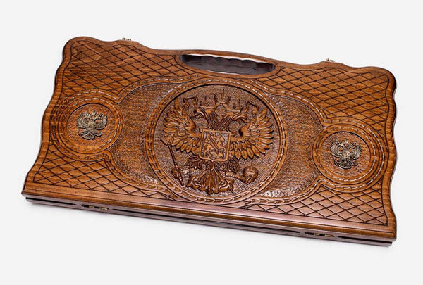 Carved beechwood backgammon board with the Russian coat of arms and bronze roundels, propped open