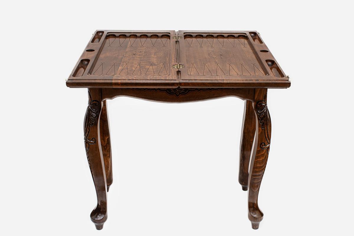 Scalloped chess and backgammon table closed, angled view of the carved legs