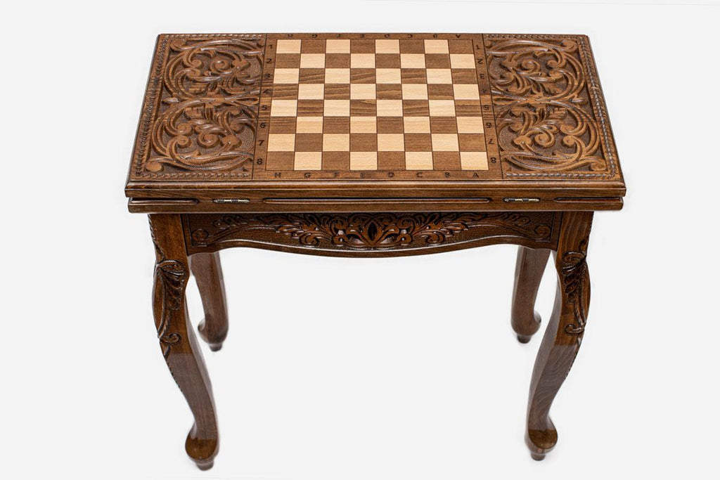 Scrollwork chess and backgammon table opened flat showing the inlaid playing field