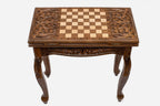 Scrollwork chess and backgammon table opened flat showing the inlaid playing field
