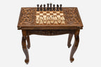Scrollwork chess and backgammon table set up for chess, straight front view