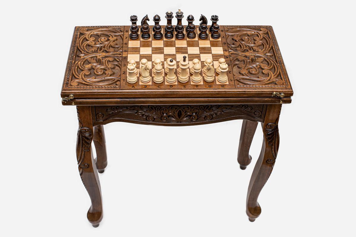 Scrollwork chess and backgammon table set up for chess, straight front view