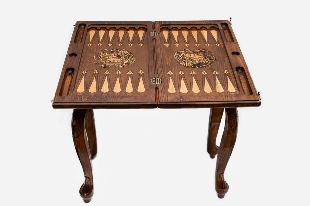 Close-up of the carved leg and drawer front with the Armenian coat of arms