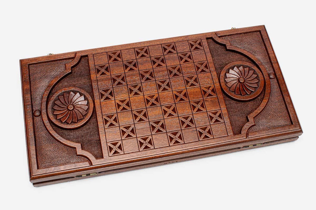 The backgammon board opened to show the wooden playing surface