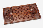 The backgammon board opened to show the wooden playing surface