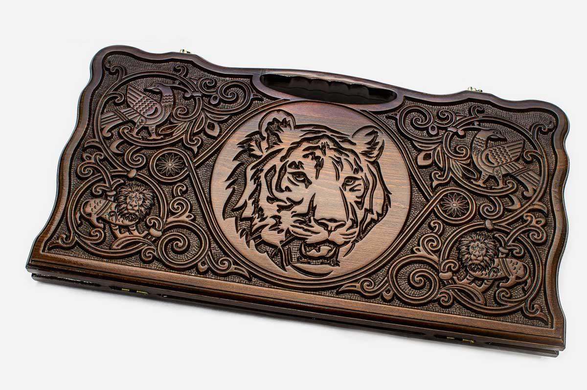 Carved beechwood backgammon board with a commanding tiger and a carry handle, propped open