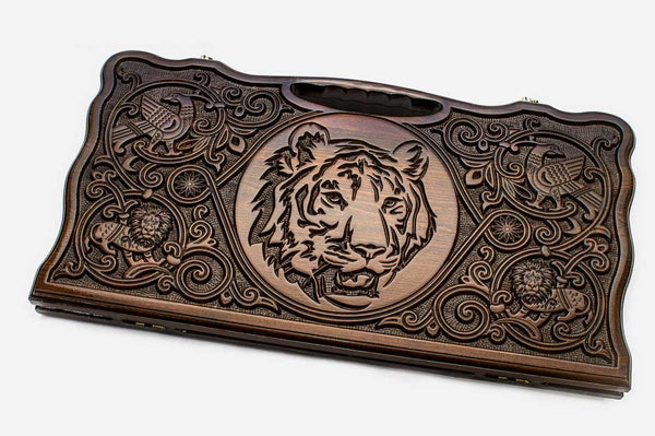 Carved beechwood backgammon board with a commanding tiger and a carry handle, propped open
