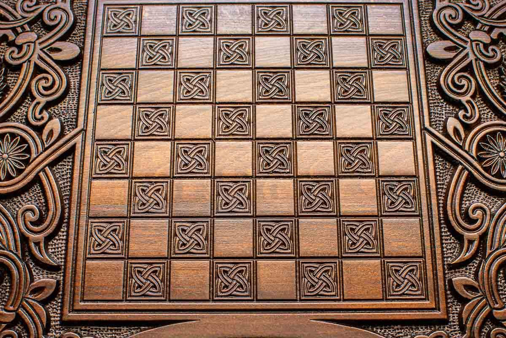 The backgammon board opened to show the wooden playing surface
