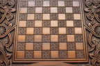The backgammon board opened to show the wooden playing surface