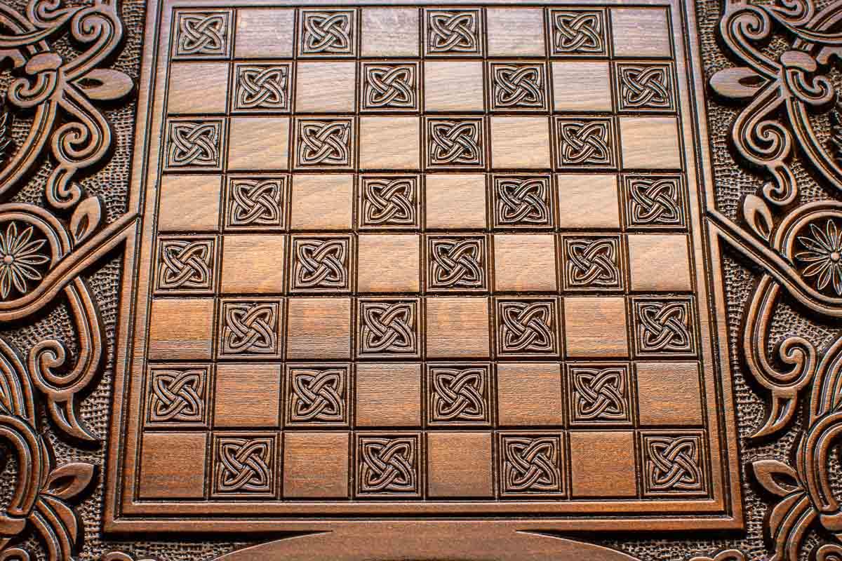 The backgammon board opened to show the wooden playing surface