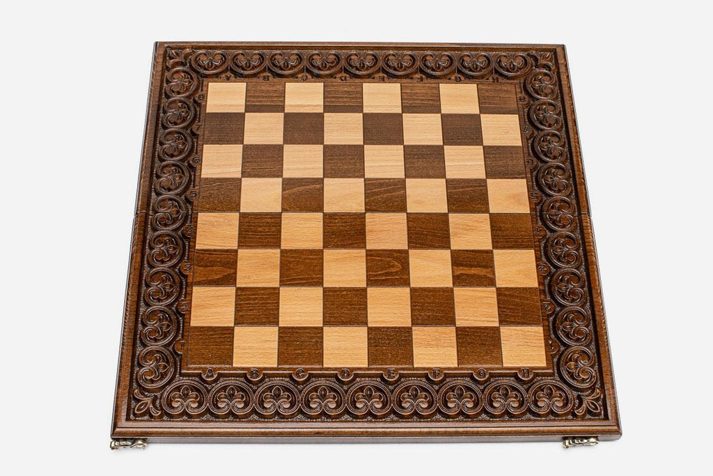 Fine hand-carved detailing on a wooden chess board frame - close-up