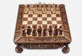 Atlant carved chess set with hand-carved wood pieces set up for play, front view
