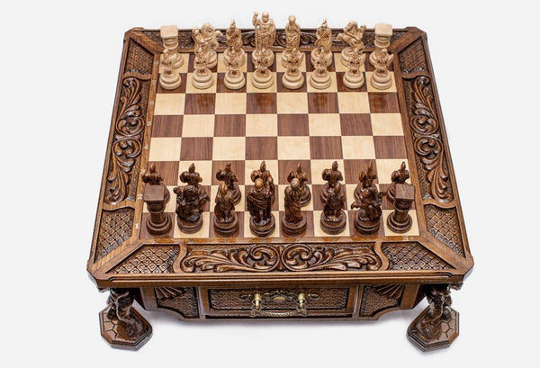 Atlant carved chess set with hand-carved wood pieces set up for play, front view