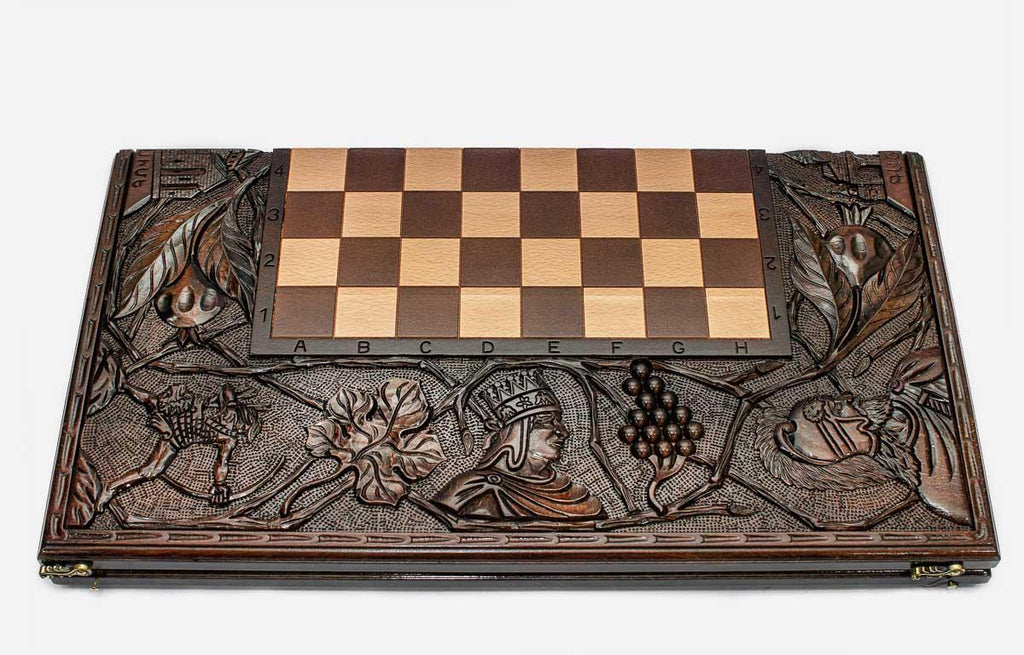Crowned kings hand-carved on a luxury chess board - close-up