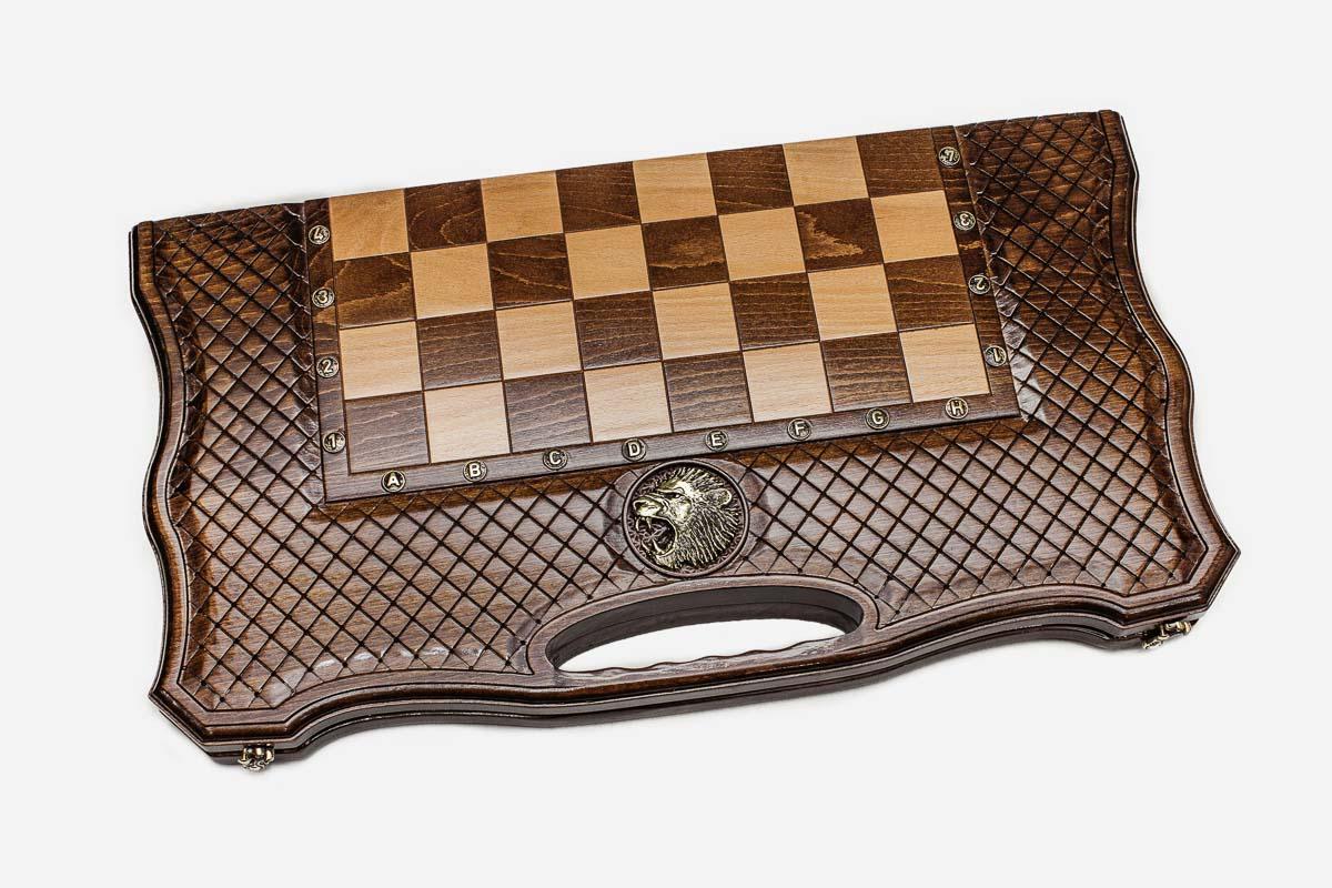 Regal lion hand-carved at the heart of a wooden chess board - detail