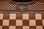 Close-up of the faceted wooden chess pieces on the maple inlaid squares