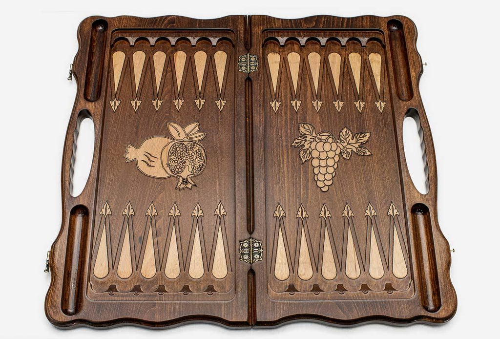 Pomegranate and grapevine hand-carved on a luxury chess board - detail