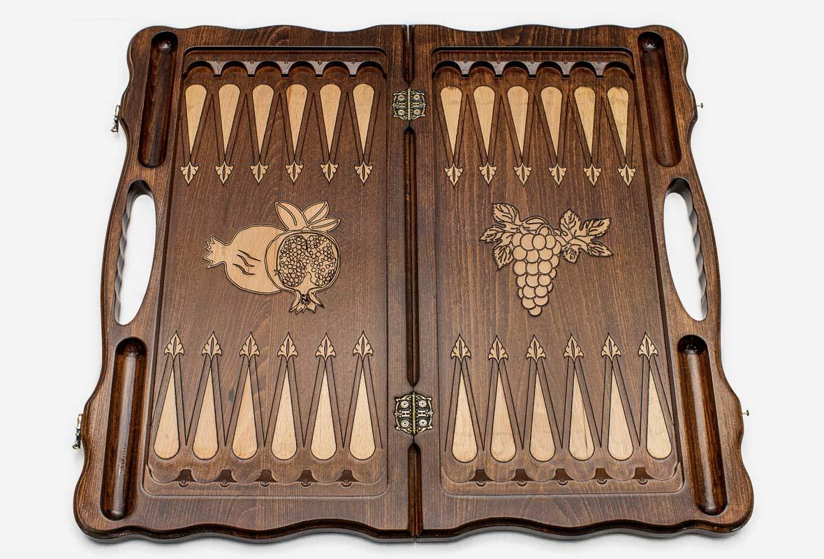Pomegranate and grapevine hand-carved on a luxury chess board - detail