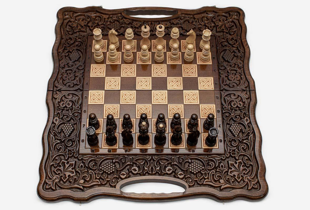 Carved fruit and vine frame on a wooden chess set - side view