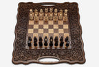 Carved fruit and vine frame on a wooden chess set - side view