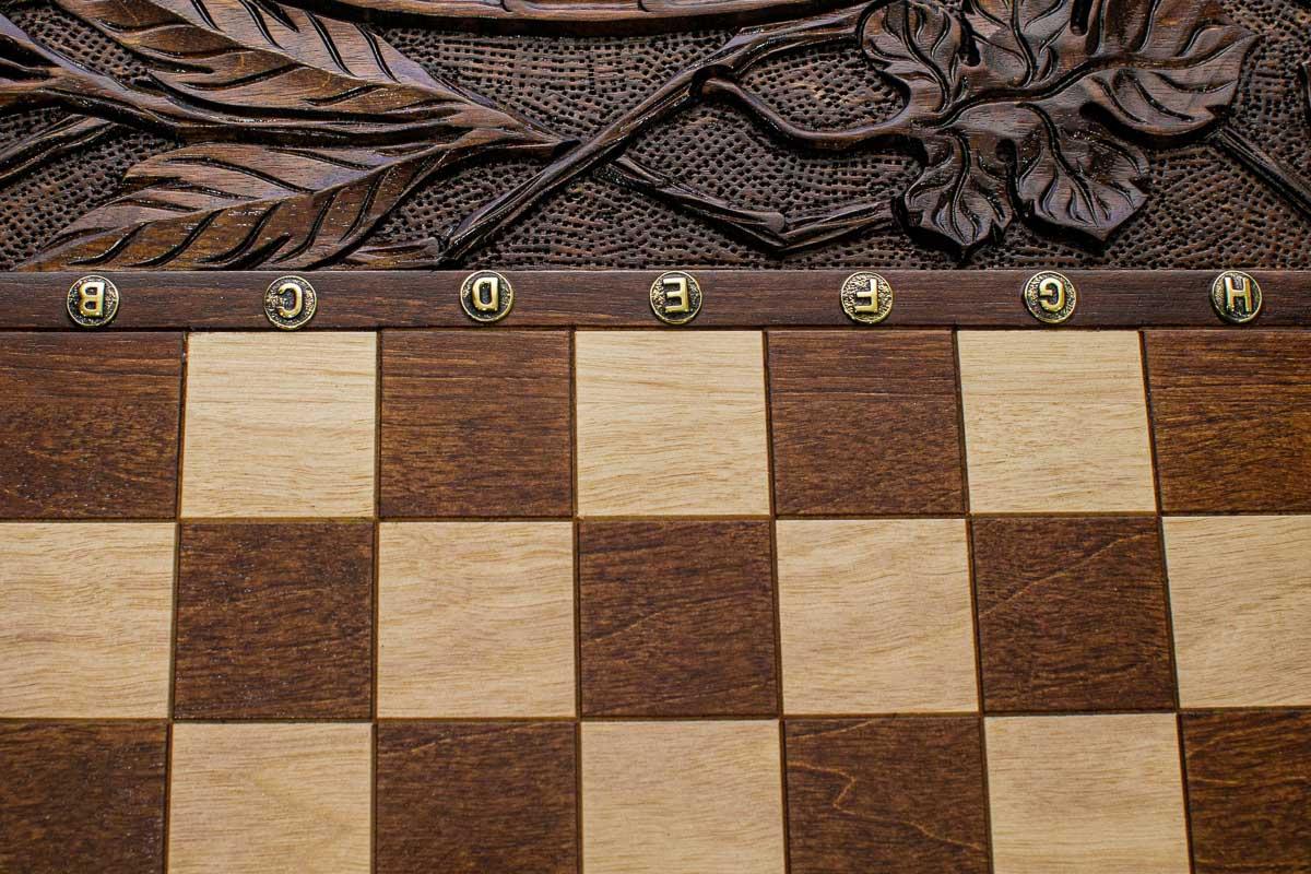 Carved abundance motifs on solid walnut - side view