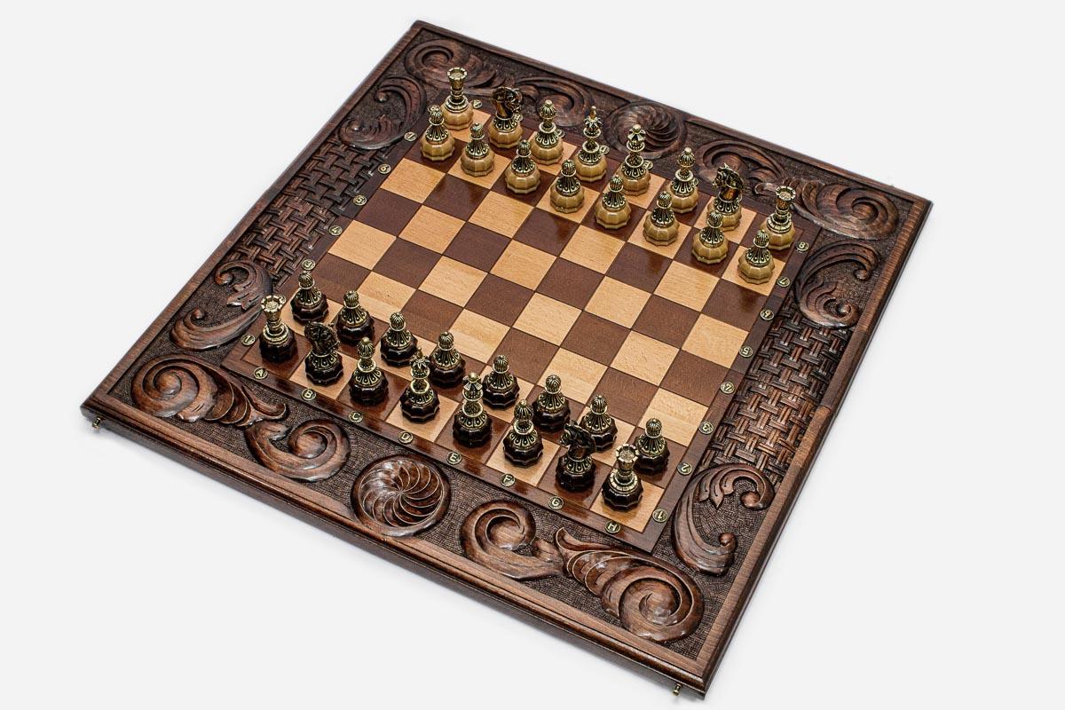 Figural bronze chess pieces on the eternity knot board - detail