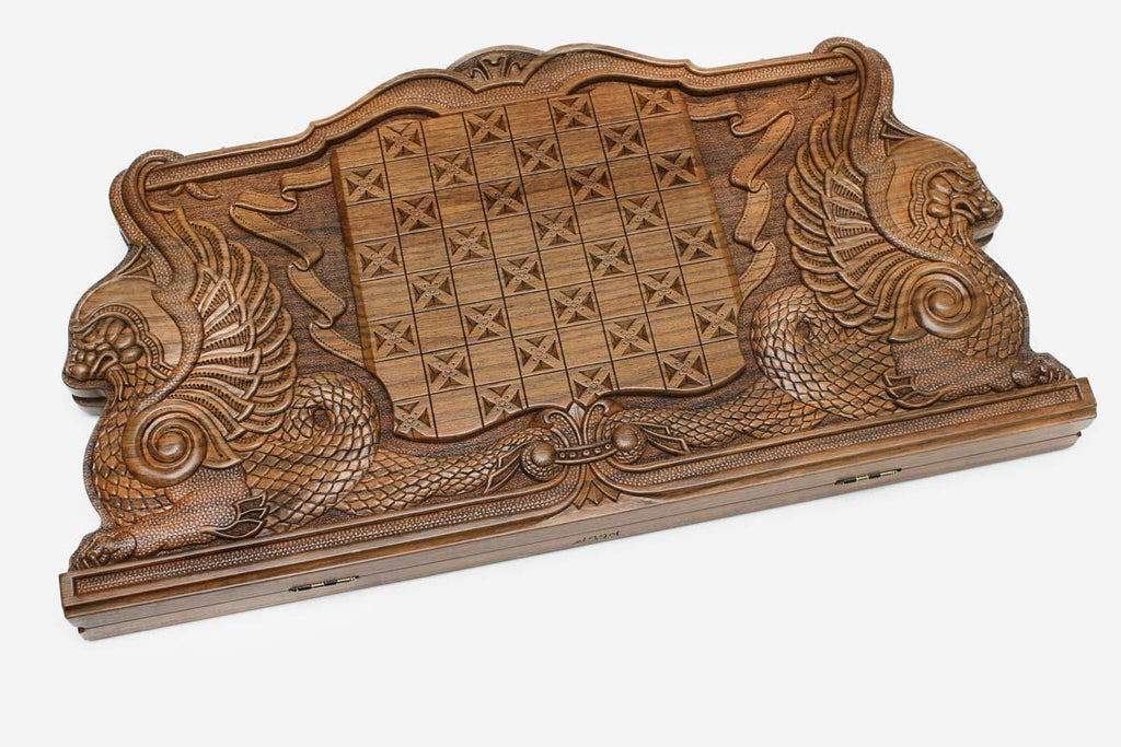 Angled view of the dragon master carved walnut backgammon board