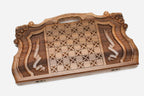 Angled view of the Mher and the lion master walnut backgammon board
