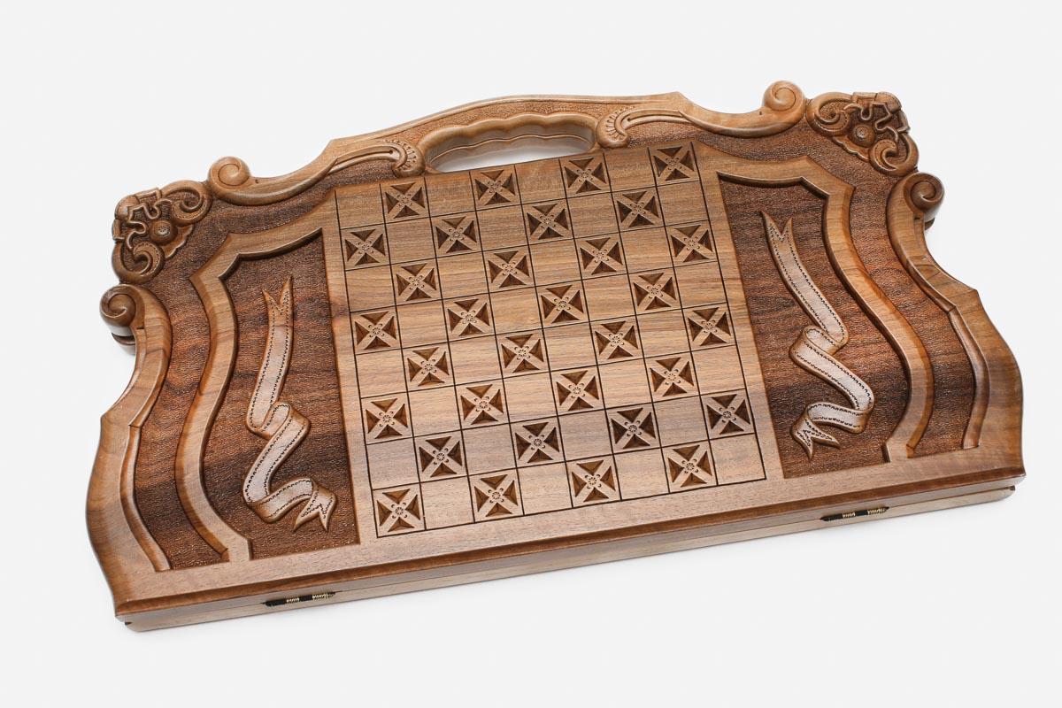 Angled view of the Mher and the lion master walnut backgammon board