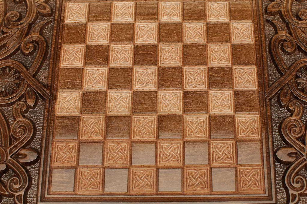 The backgammon board opened to show the wooden playing surface