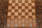 The backgammon board opened to show the wooden playing surface