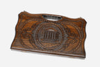 Compact carved backgammon board with the Temple of Garni and a carry handle, propped open
