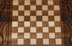 The backgammon board opened to show the wooden playing surface