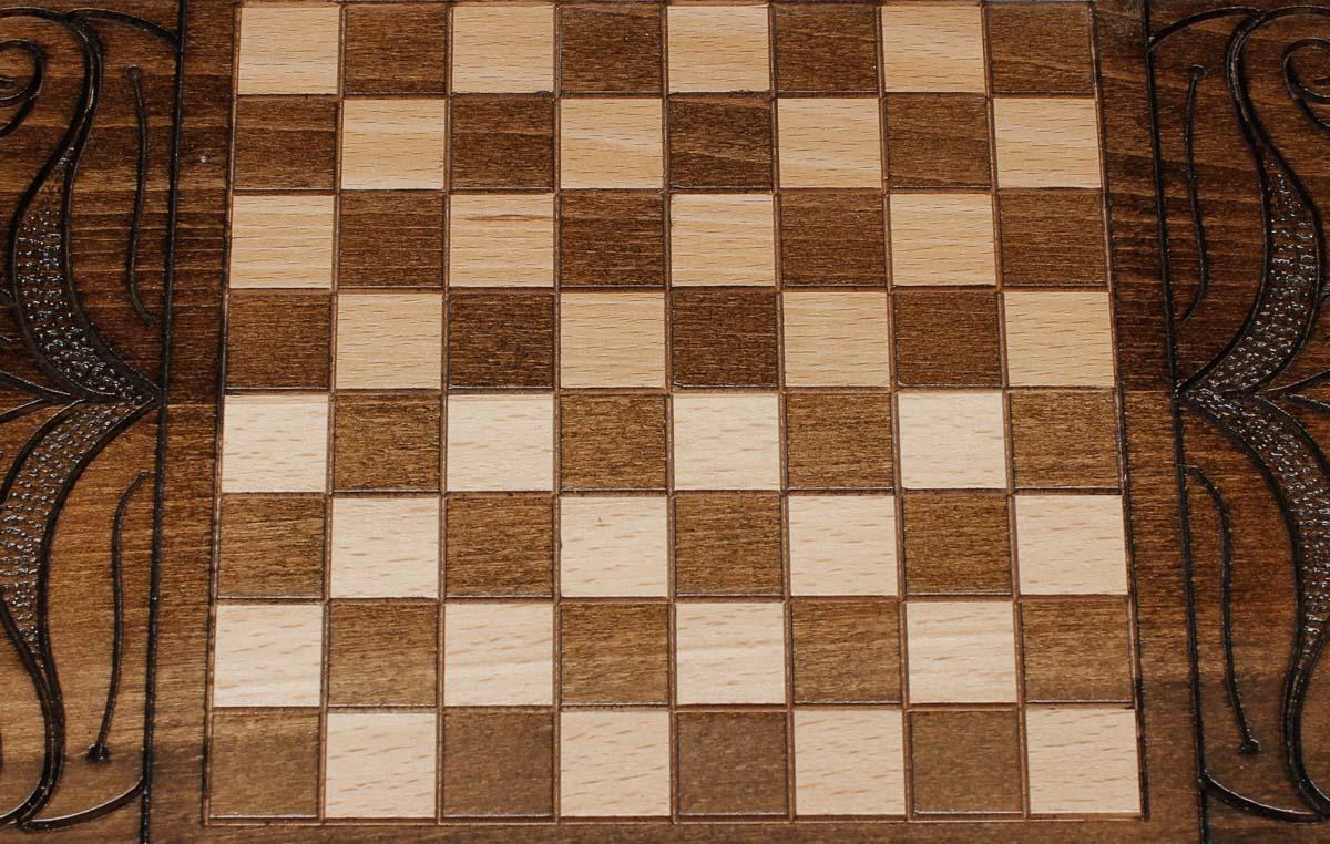 The backgammon board opened to show the wooden playing surface