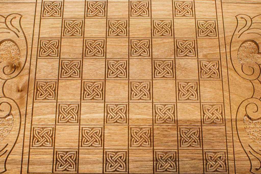 The backgammon board opened to show the wooden playing surface