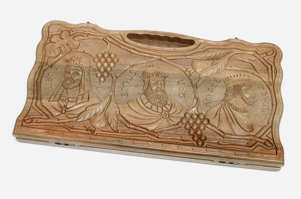 Angled view of the two kings carved walnut backgammon board