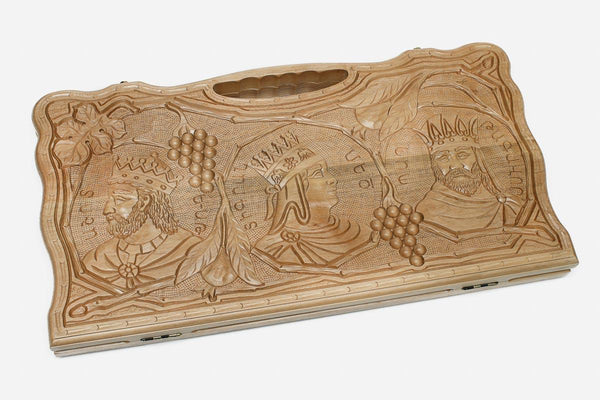 Carved walnut backgammon board with two crowned kings and grape clusters, propped open