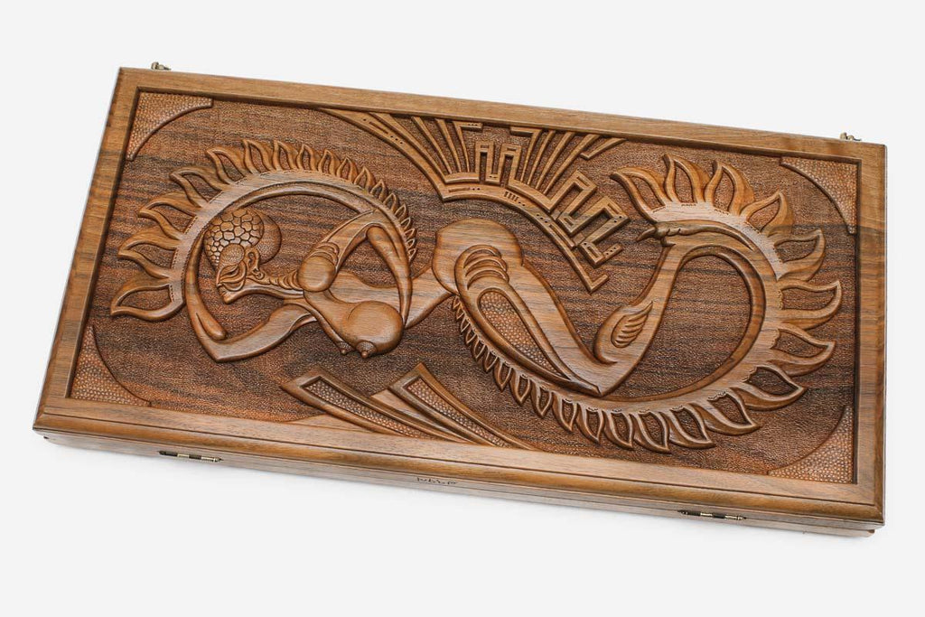 Master-carved walnut backgammon board with a surreal Martian design, propped open