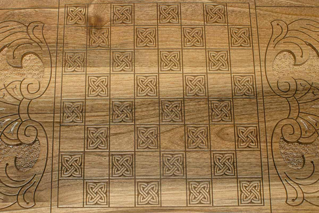 The backgammon board opened to show the wooden playing surface