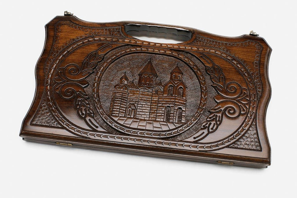 Compact carved backgammon board with Etchmiadzin Cathedral and a carry handle, propped open