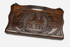 Compact carved backgammon board with Etchmiadzin Cathedral and a carry handle, propped open