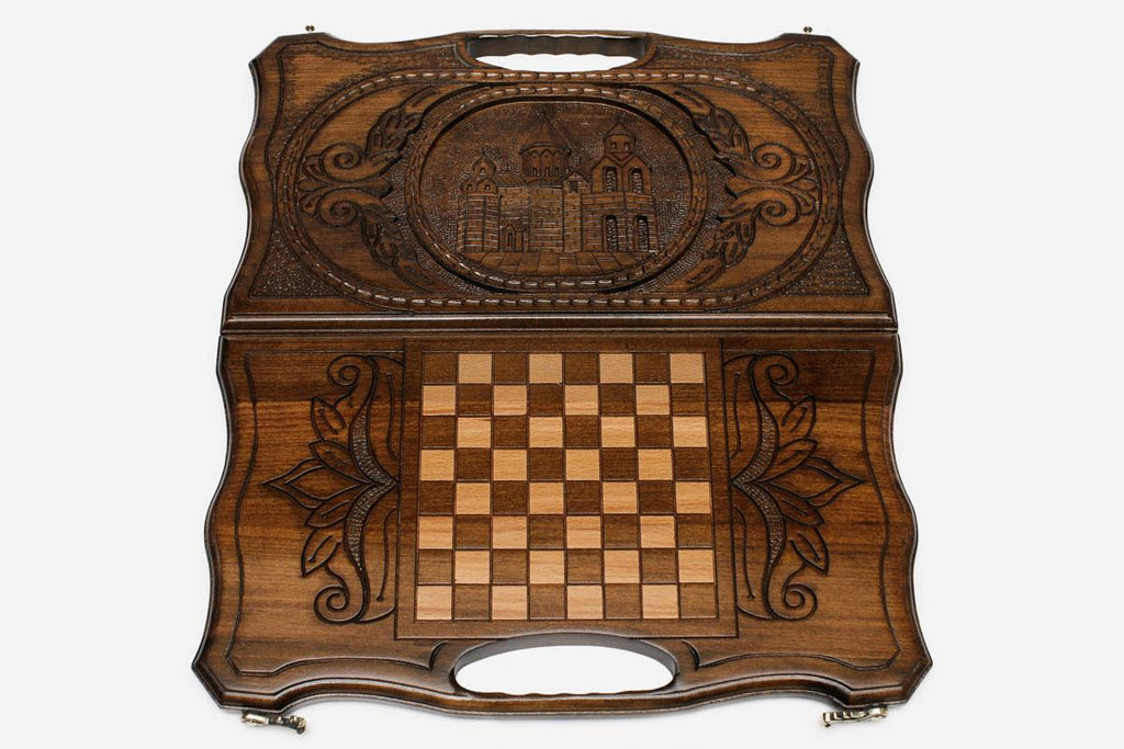 The backgammon board opened to show the wooden playing surface