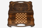 The backgammon board opened to show the wooden playing surface