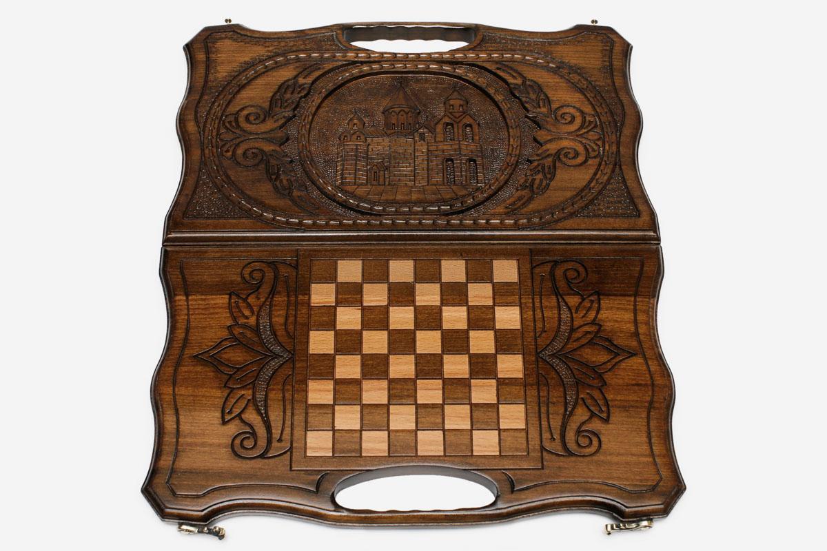 The backgammon board opened to show the wooden playing surface
