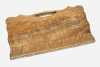 Angled view of the three scenes carved walnut backgammon board