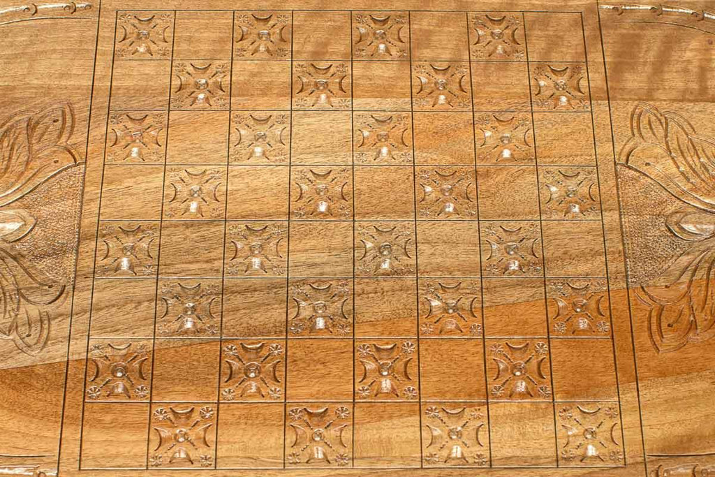 The backgammon board opened to show the wooden playing surface