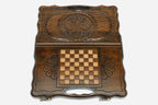Side view of the folded travel board with its carry handle