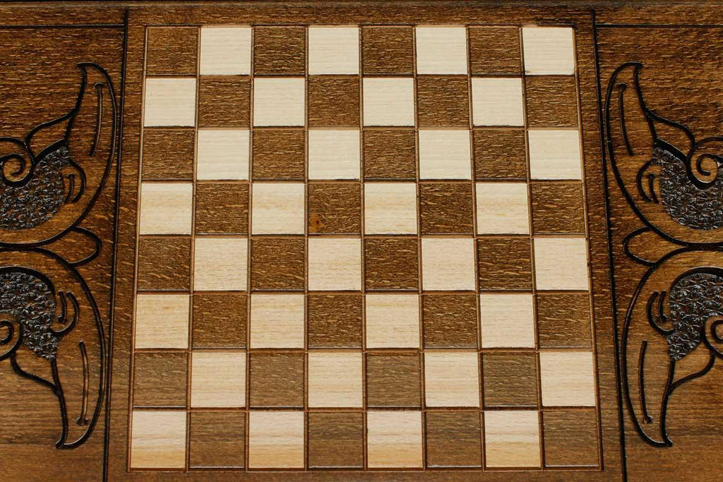 The backgammon board opened to show the wooden playing surface