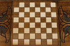 The backgammon board opened to show the wooden playing surface